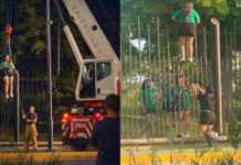 Mujer queda atorada en valla tras intentar entrar gratis al Fan Fest de Monterrey